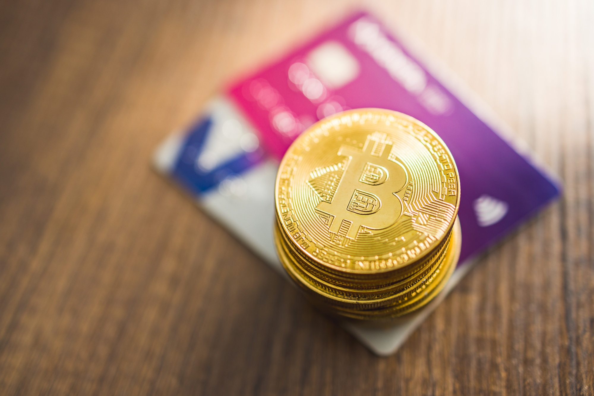 Cryptocurrency. Bitcoin virtual money. Golden coins and credit cards